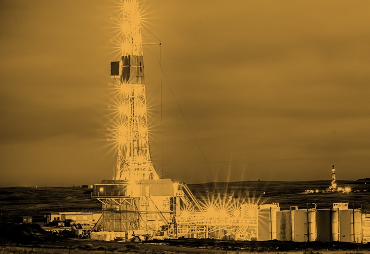 Moody yellow energy block services large rig in night